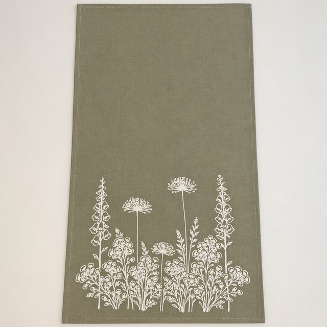 Linen Sage Green towel with white floral pattern on a light beige background