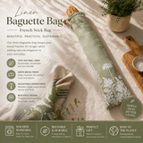 Linen baguette bag with botanical design on a sage green linen on natural background