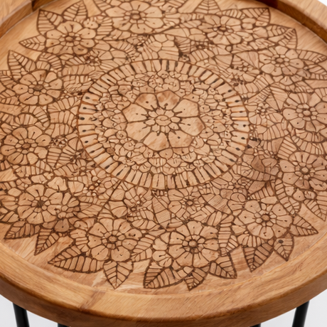 Wooden table with intricate patterns and black hairpin legs, shown from different angles.