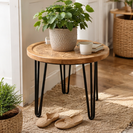 Round wooden table with black hairpin legs in various home decor settings.