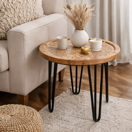 Round wooden table with black hairpin legs in various home decor settings.