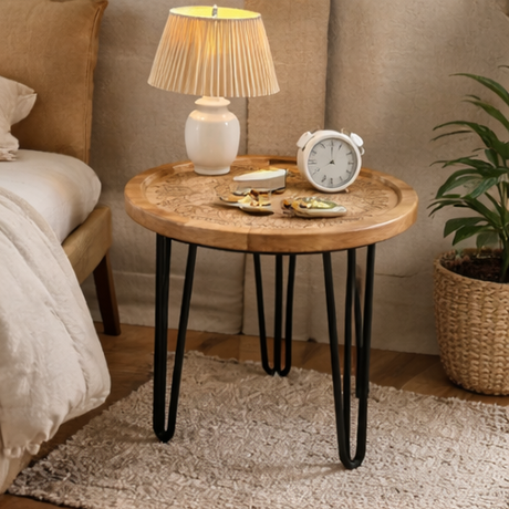 Round wooden table with black hairpin legs in various home decor settings.