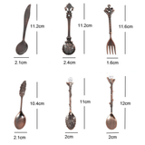 Measurement chart of various decorative spoons, forks, and knives on a white background.