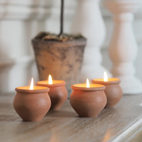 Boxed set of four handmade Murgan candles from India