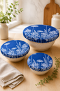A set of three reusable Navy Florilegium linen bowl covers, hand printed in Derbyshire with a delicate white botanical design featuring agapanthus and foxglove flowers. Lined with ProCare® FoodSAFE waterproof fabric, they are ideal for covering leftovers, salads, fruit bowls, prep bowls and rising dough while reducing the need for cling film.