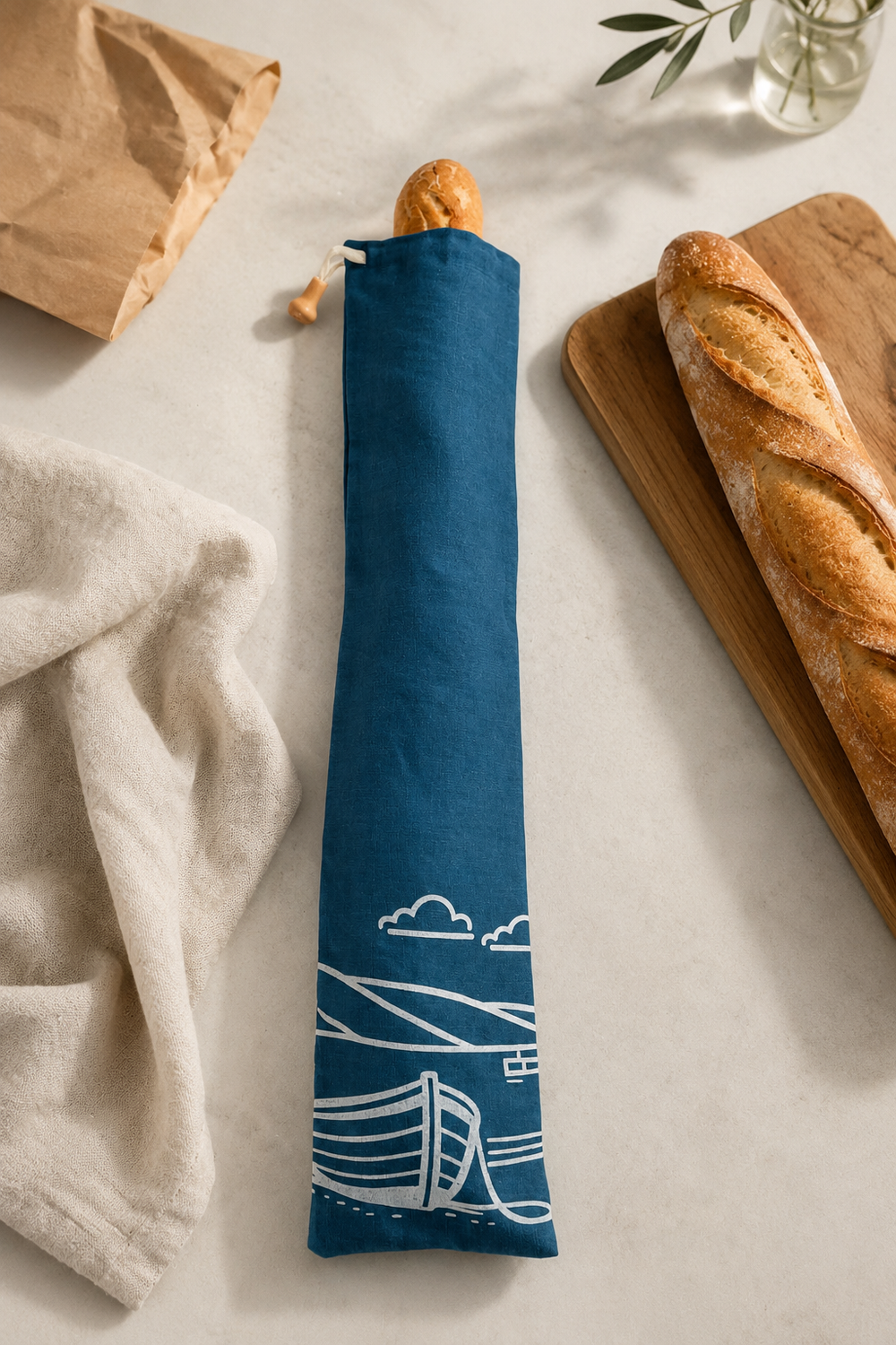 Navy linen baguette bag with white Fjære coastal print, hand printed in Derbyshire for storing French sticks and artisan baguettes.

