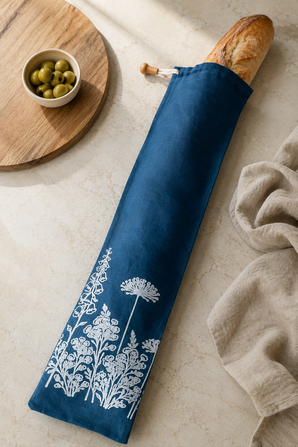 Navy linen baguette bag with white Florilegium floral print, hand printed in Derbyshire for storing French sticks and artisan baguettes.