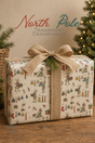 Reindeer Christmas wrapping paper showing North Pole reindeer hanging colourful jumpers, scarves and stockings on washing lines with baskets of festive laundry