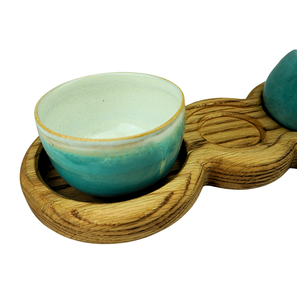 Oak table centrepiece serving board with three stoneware bowls
