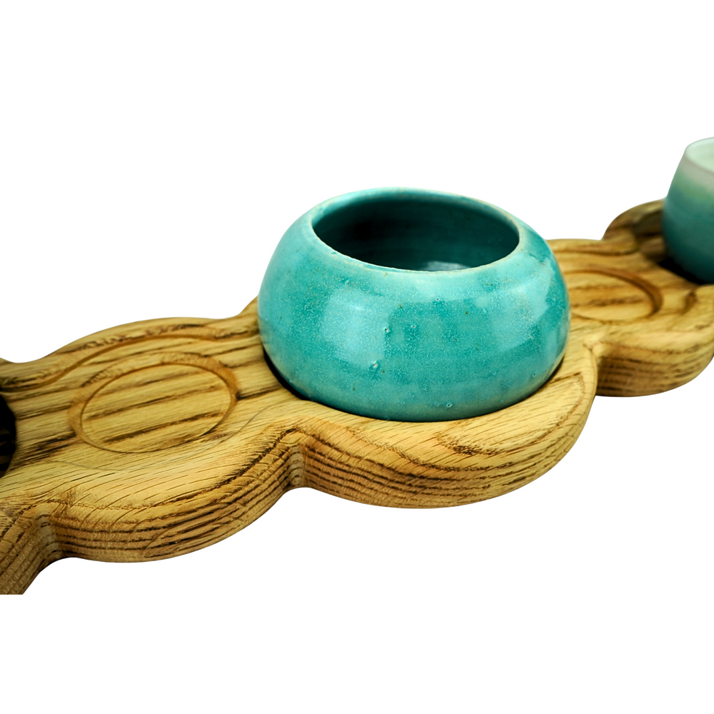Oak table centrepiece serving board with three stoneware bowls