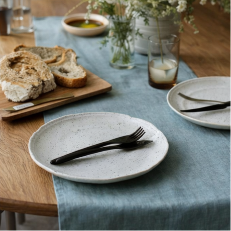 Ocean Mint Linen Table Runner on a dining table setting with food and tableware.