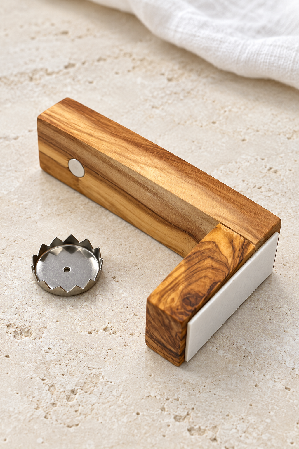 Olive wood magnetic soap holder with the soap disc removed to reveal the round magnet beneath the arm.