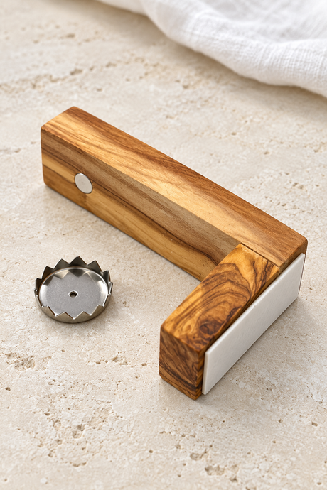 Olive wood magnetic soap holder with the soap disc removed to reveal the round magnet beneath the arm.