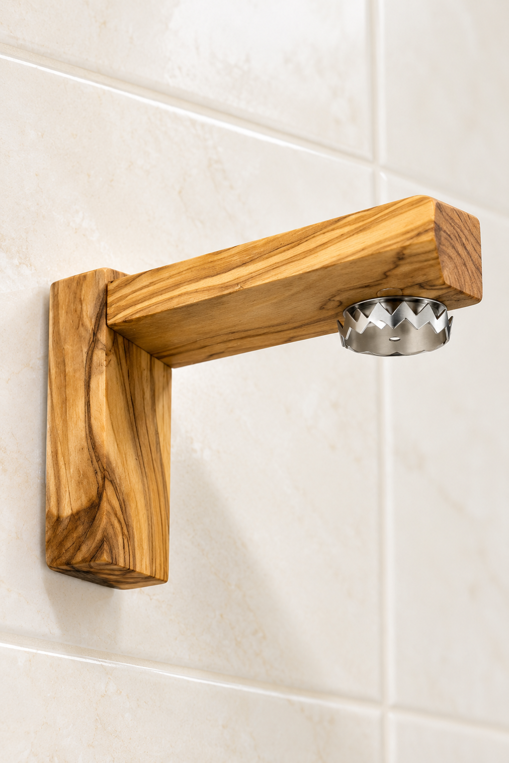 Olive wood magnetic soap holder with the soap disc removed to reveal the round magnet beneath the arm.