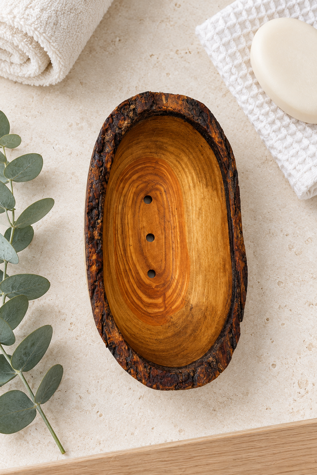 Warm olive wood grain, a rustic bark edge and a simple oval shape bring natural texture to the bathroom basin. This handmade soap dish has three drainage holes and an underside groove