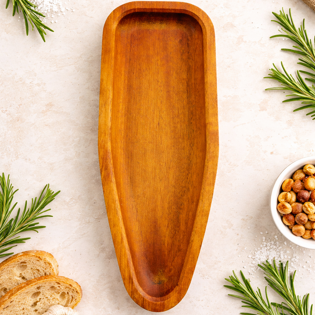 Wooden tray on a light surface with rosemary and chickpeas