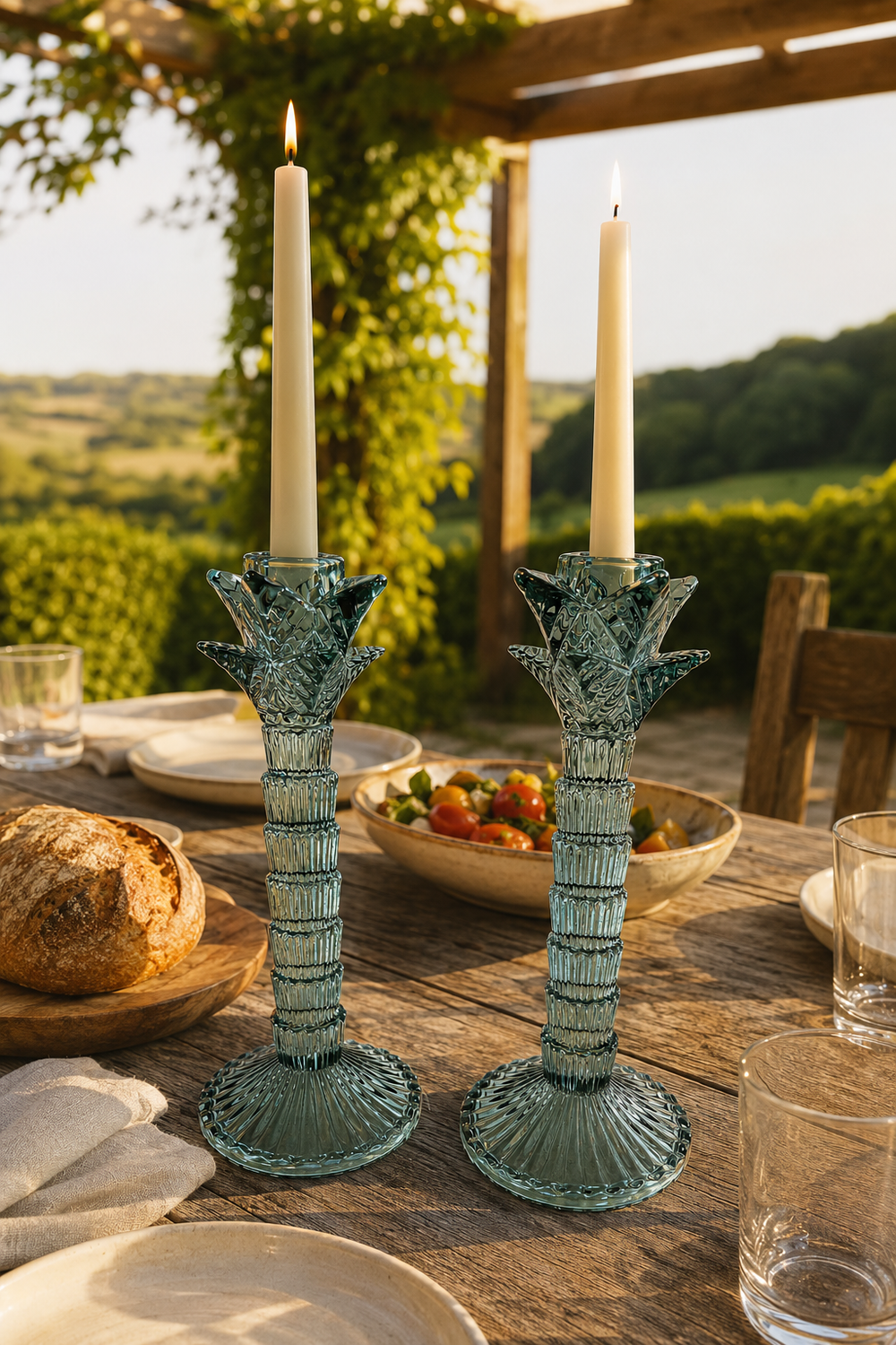 Pair of green glass palm tree candlestick holders with ribbed stems and fluted round bases