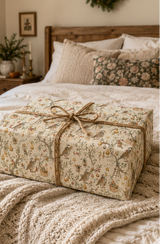 Partridges hold golden stars while tiny mice climb ladders and decorate pear trees with baubles, ribbon and gifts. A detailed pencil-sketch Christmas wrapping paper inspired by a familiar festive favourite.