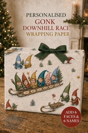 Personalised Gonk Downhill Race wrapping paper shown wrapped around a gift box with a dark green bow. The wrapping paper features a vintage-style illustration of gnome characters in a sled, with text reading 'PERSONALISED GONK DOWNHILL RACE WRAPPING PAPER' and a red badge that says 'ADD 6 FACES & 6 NAMES'.