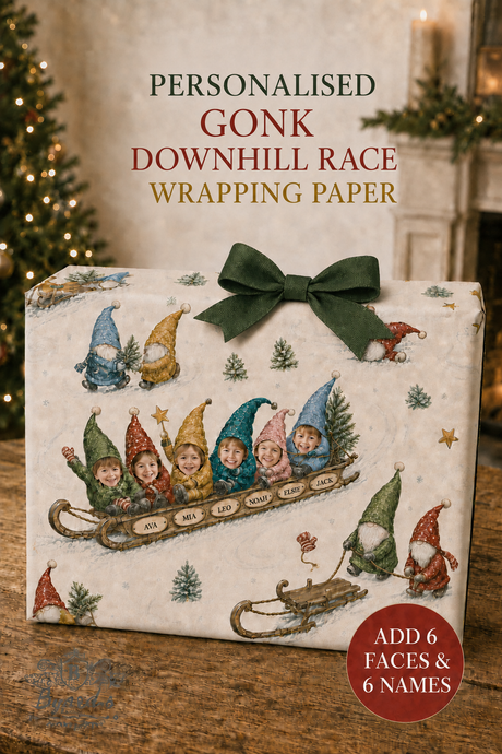 Personalised Gonk Downhill Race wrapping paper shown wrapped around a gift box with a dark green bow. The wrapping paper features a vintage-style illustration of gnome characters in a sled, with text reading 'PERSONALISED GONK DOWNHILL RACE WRAPPING PAPER' and a red badge that says 'ADD 6 FACES & 6 NAMES'.