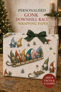 Personalised Gonk Downhill Race wrapping paper shown wrapped around a gift box with a dark green bow. The wrapping paper features a vintage-style illustration of gnome characters in a sled, with text reading 'PERSONALISED GONK DOWNHILL RACE WRAPPING PAPER' and a red badge that says 'ADD 6 FACES & 6 NAMES'.