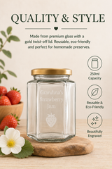 A clear glass jar with a gold lid and personalised engraving reading 'Grandma's Strawberry Jam,' shown on a wooden board with strawberries and a white flower. Text above describes the jar as premium glass, reusable, eco-friendly, and suitable for homemade preserves.