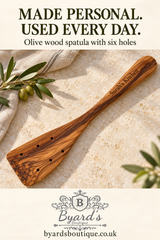 “Made personal. Used every day.” pin showing a six-hole olive wood spatula, Byard’s Boutique logo and website.