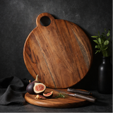 wooden cutting boards in various settings with food and decor elements.
