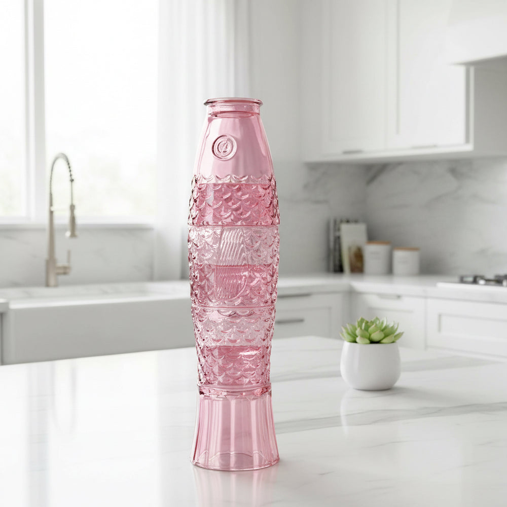 Pink stacking glass's that make a fish when stacked set in a kitchen