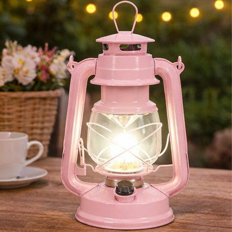 Pink lantern with battery compartment and light on a table