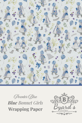 Patterned wrapping paper featuring illustrated blue bonnet girls in white dresses with blue bows, scattered blue balloons, and small floral details on a pale background. A cream band at the bottom reads 'Powder Blue Blue Bonnet Girls Wrapping Paper' with the Byard's brand mark.