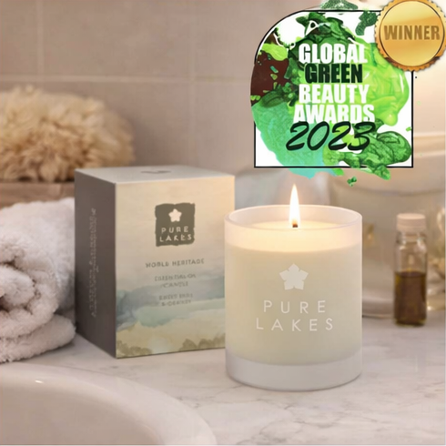 Pure Lakes candles with packaging and decorative elements.