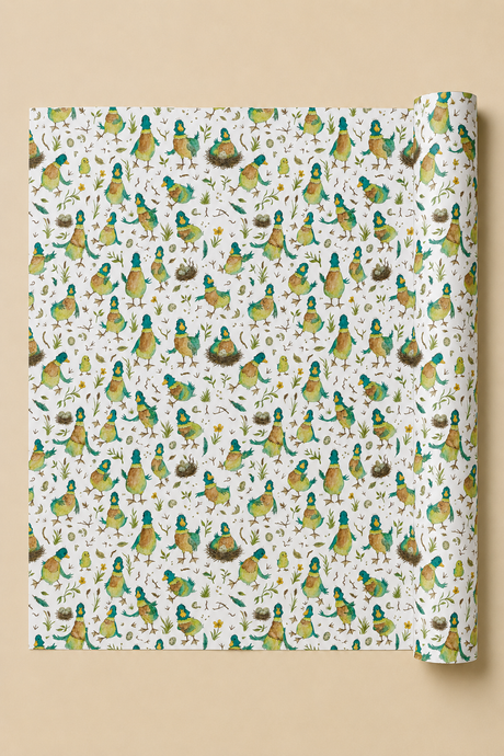 A roll of wrapping paper with a dense pattern of illustrated birds in green, yellow, and brown on an off-white background, shown against a solid beige backdrop.