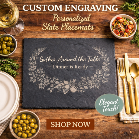 Slate placemat with floral design on a wooden table with food and cutlery, featuring text about custom engraving.