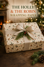 Red-breasted robins perch among glossy holly, rosehips, winter twigs and golden stars in this traditional illustrated Christmas wrapping paper on a warm cream ground.