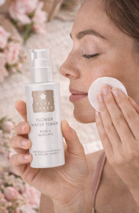 Flower water facial toner product with text on a soft, floral background. Pure Lakes