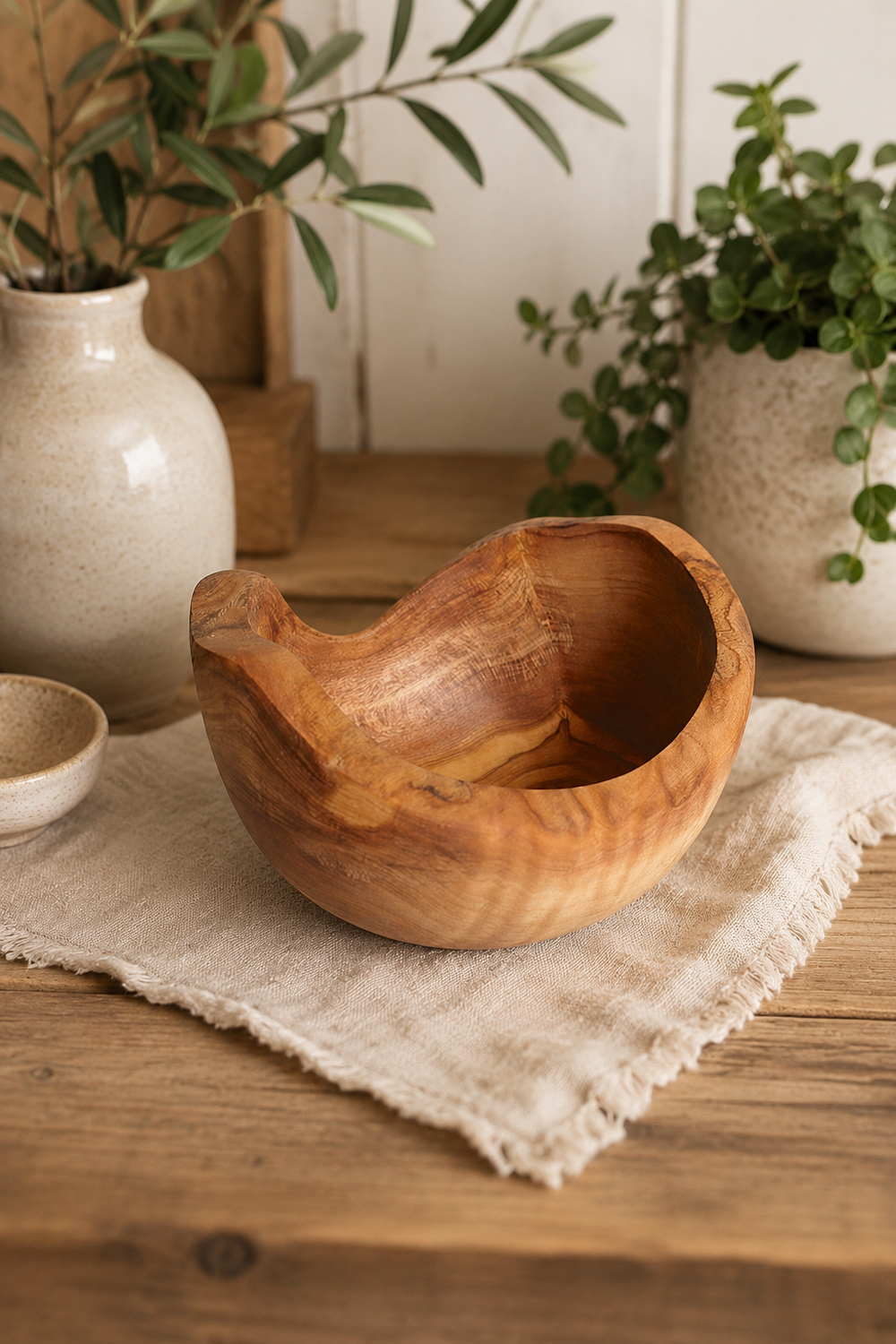 Rustic round olive wood snack bowl with natural grain