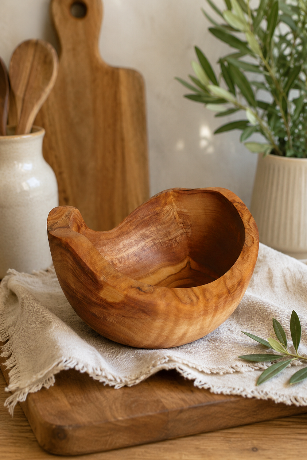 Rustic wooden snack bowl made from olive wood
