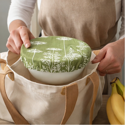 green patterned bowls with lids used in various settings.