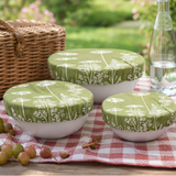 Collage of green patterned bowls with lids used in various settings.