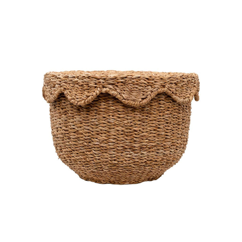 Woven basket with scalloped edge on a white background