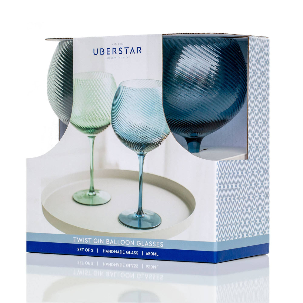 Set of three twist gin balloon glasses in a Uberstar box on a white background