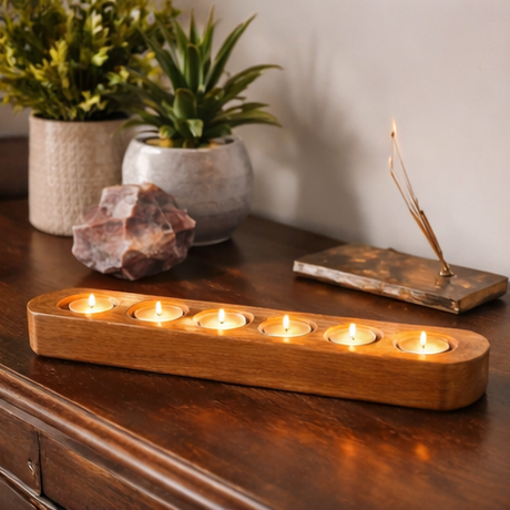wooden candle holders with lit candles 