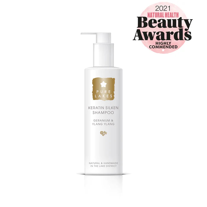 Shampoo bottle with 'Pure Lakes' branding and '2021 Natural Health Beauty Awards Highly Commended' badge on a white background.