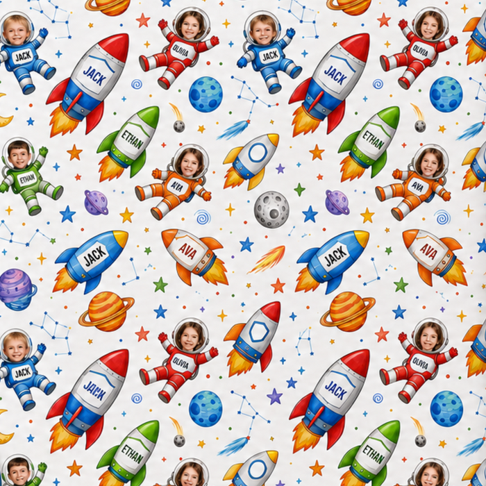 Personalized space crew wrapping paper shown as a roll and flat preview on a blue promotional background. The paper has a white base with colorful cartoon astronauts, rockets, planets, and stars, plus text indicating personalization with 4 different faces and 4 different names.
