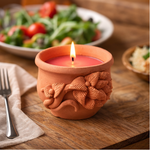 terracotta candles in dinner table settings with a warm and cozy atmosphere.