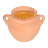 Terracotta pot candle with a white background