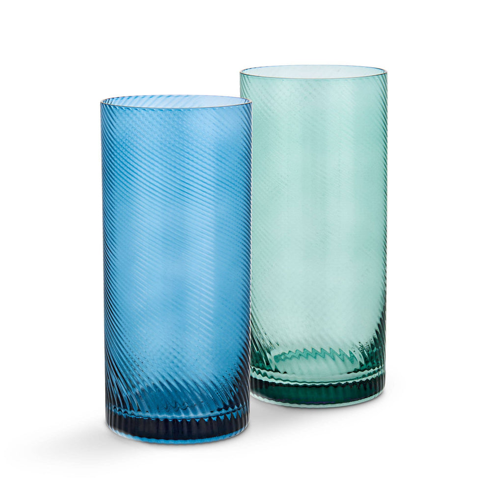 Two blue and green glass tumblers with textured design on a white background