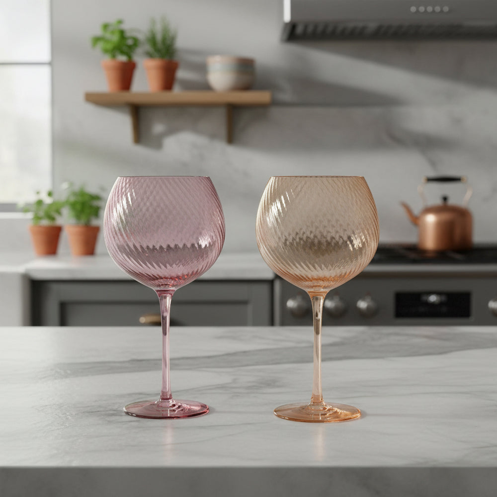 Two colourful wine glasses in a kitchen
