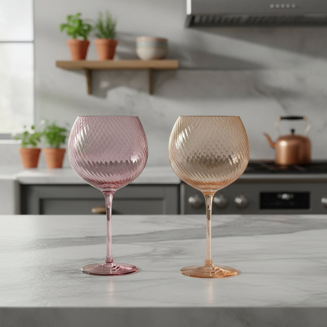 Two colourful wine glasses in a kitchen